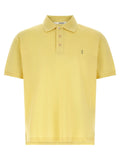 Saint laurent polo bicolore en coton jaune pâle à manches courtes avec col classique et broderie discrète poitrine
