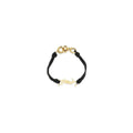 Bracelet saint laurent ovis aries noir en cuir avec logo ysl doré et fermoir doré