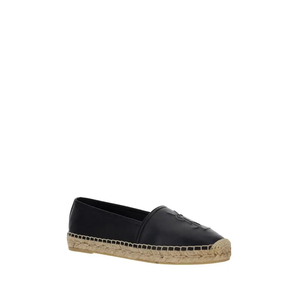 Espadrille plate noire saint laurent en cuir dagneau avec semelle en jute tressé et logo embossé discret sur le bout
