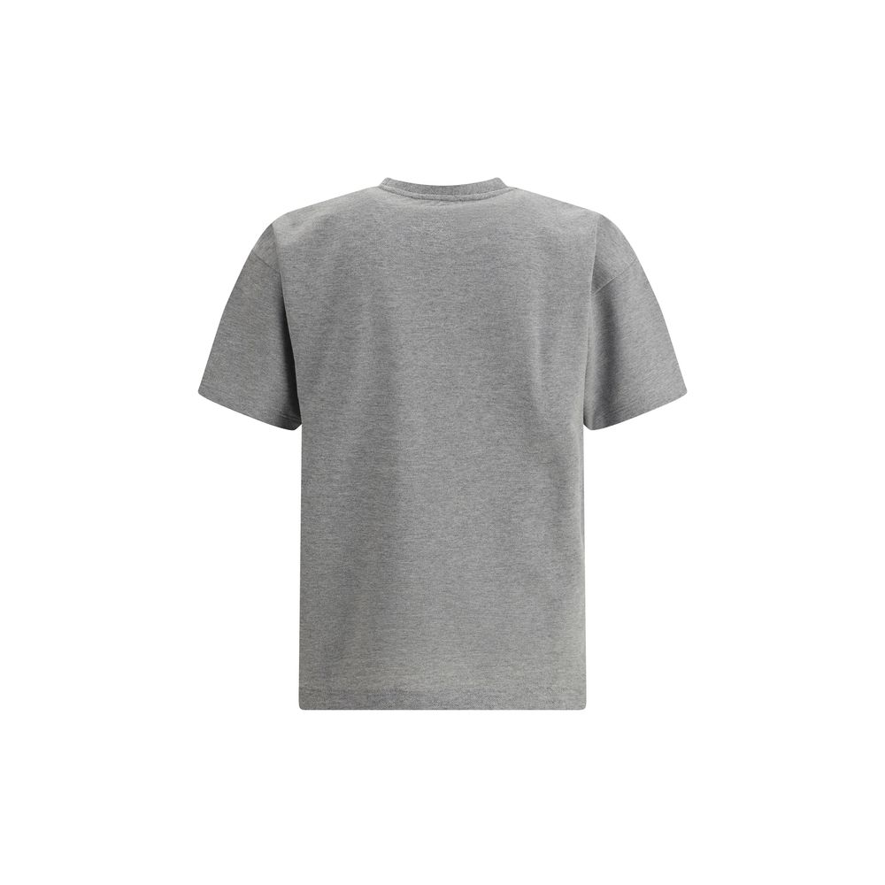 T-shirt oversize gris en coton de Saint Laurent, coupe ample, logo discret, porté sur mannequin.