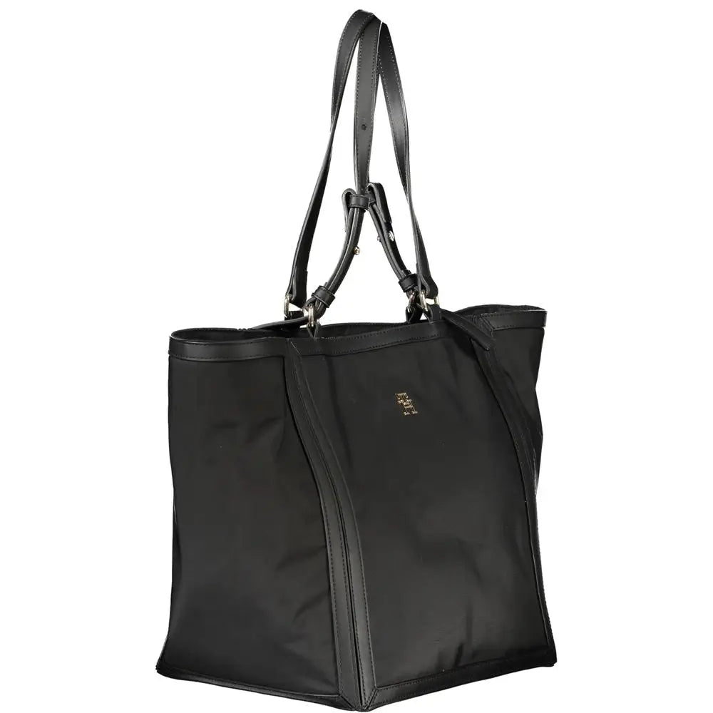 Sac fourre-tout noir en nylon tommy hilfiger avec poignées en cuir et petit logo métallique sur le devant