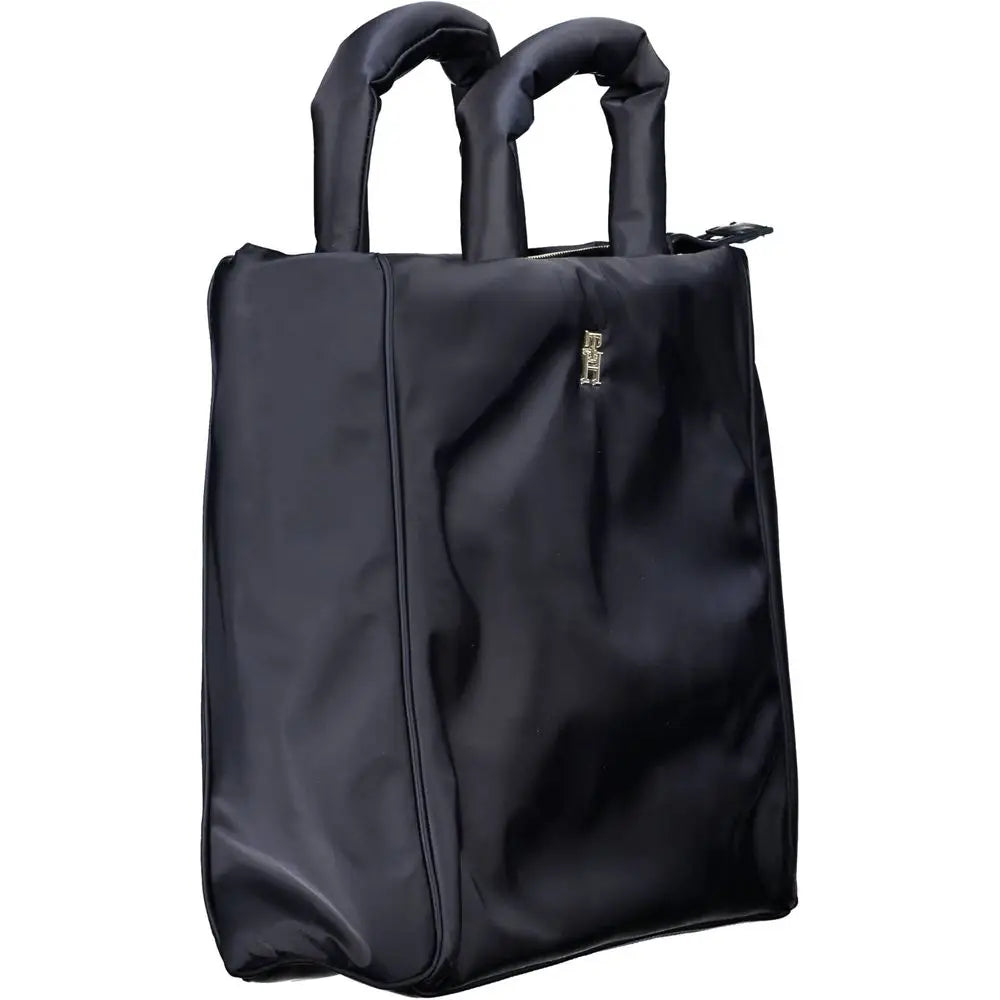 Sac fourre-tout noir en nylon tommy hilfiger avec poignées rembourrées et petit logo doré sur le devant