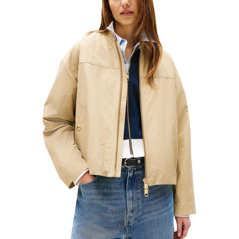Veste bomber beige en coton de Tommy Hilfiger, vue de face, avec détails de design classique et fermeture éclair visible.