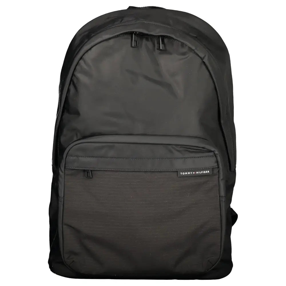 Sac à dos noir tommy hilfiger en polyester avec design minimaliste et texture subtile sur la poche avant