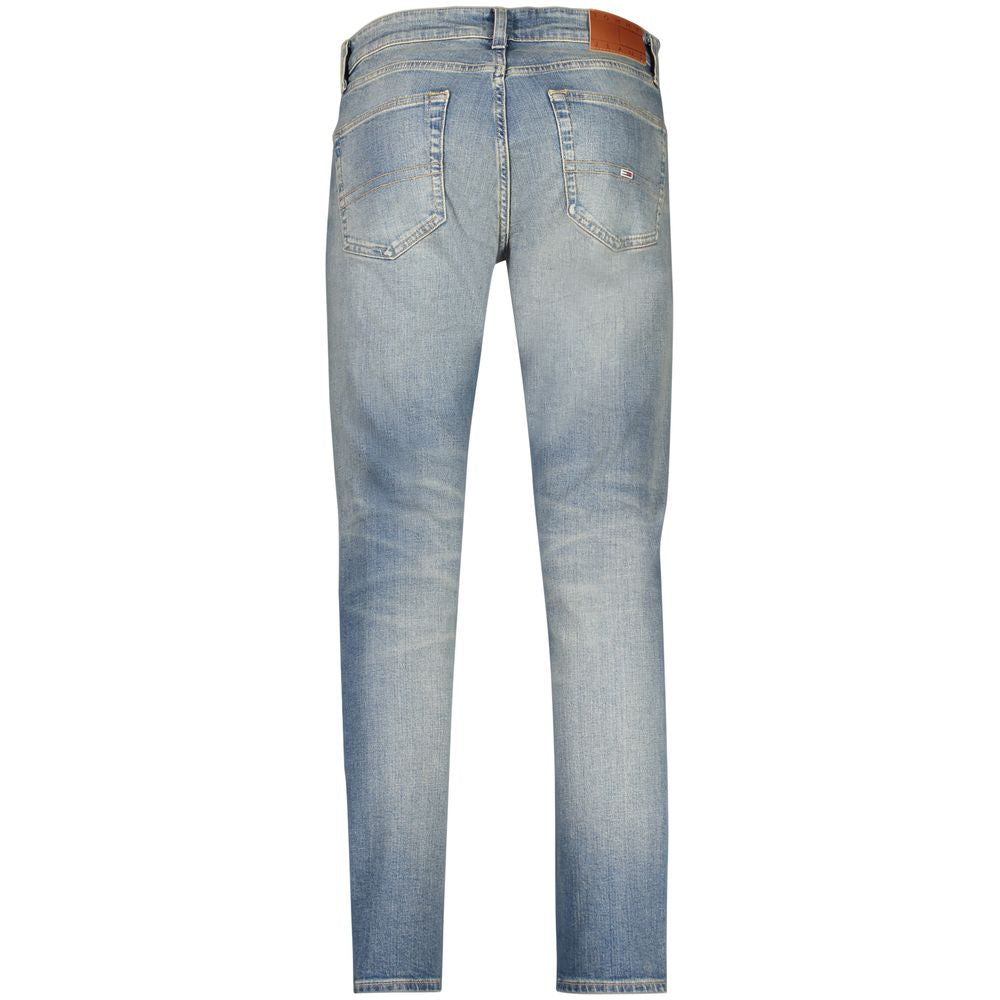 Jeans slim Tommy Hilfiger en coton bleu pour homme, coupe tapered, visible avec détails de couture et fermeture éclair.