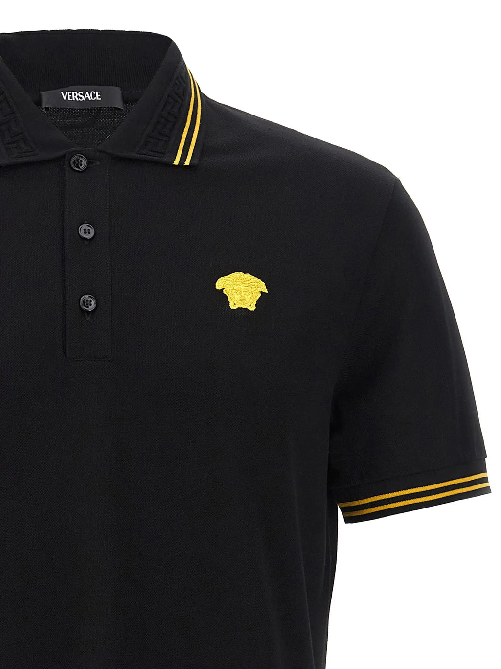 Polo versace noir en coton avec tête de meduse brodée en or et rayures assorties sur col et manches