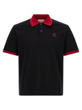 Versace black cotton polo shirt with red collar and sleeve trim and subtle embroidered logo on the chest