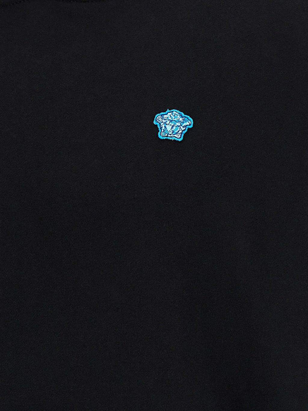 Versace black cotton sweatshirt with small embroidered blue Medusa head logo on the chest