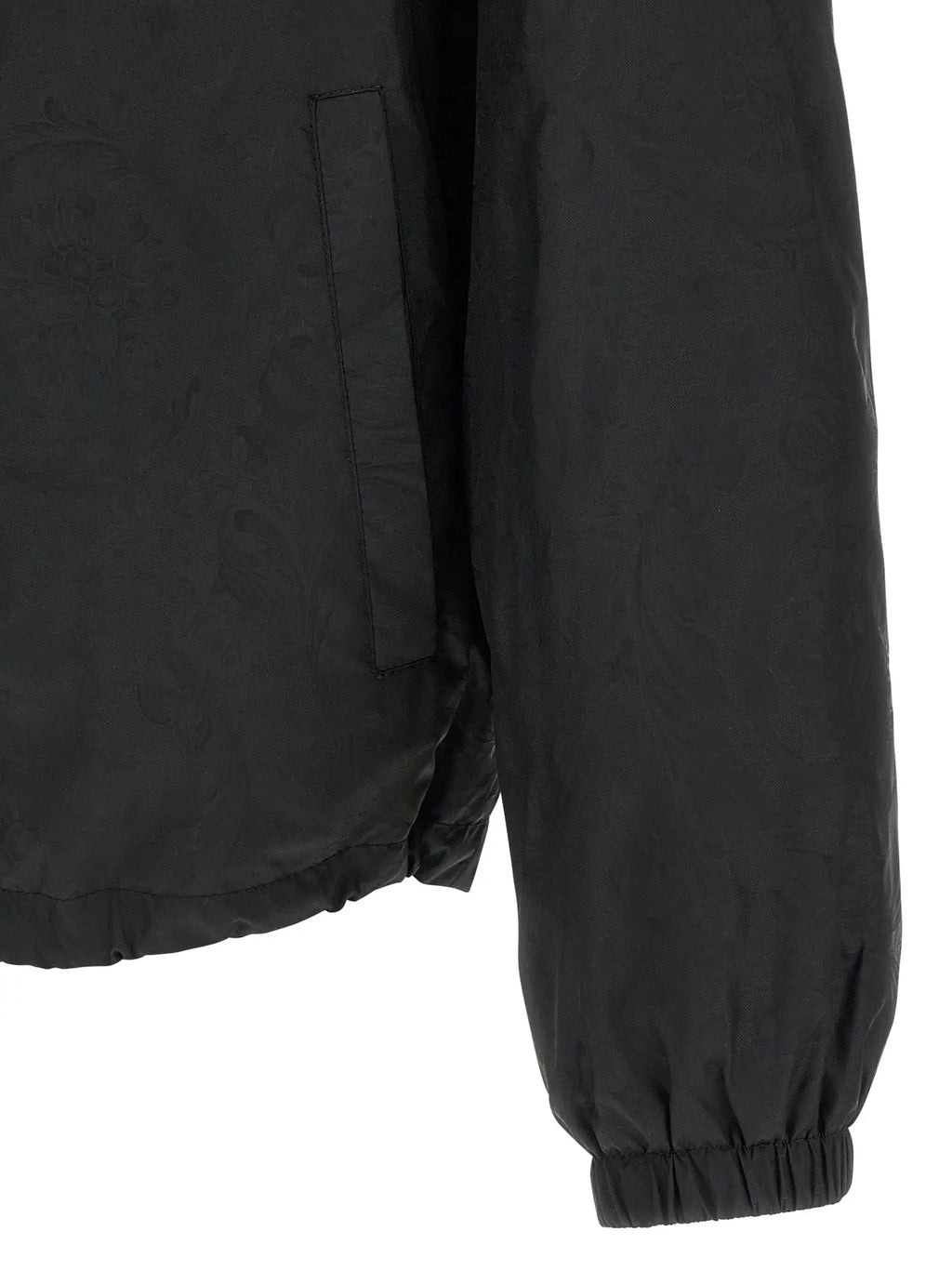 Versace veste coquille en nylon noir avec poignets elastiques et poche laterale