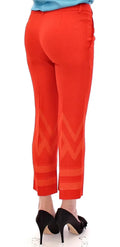 Pantalon capri versace collection rouge crop avec motif zigzag orange et rayures horizontales au bas