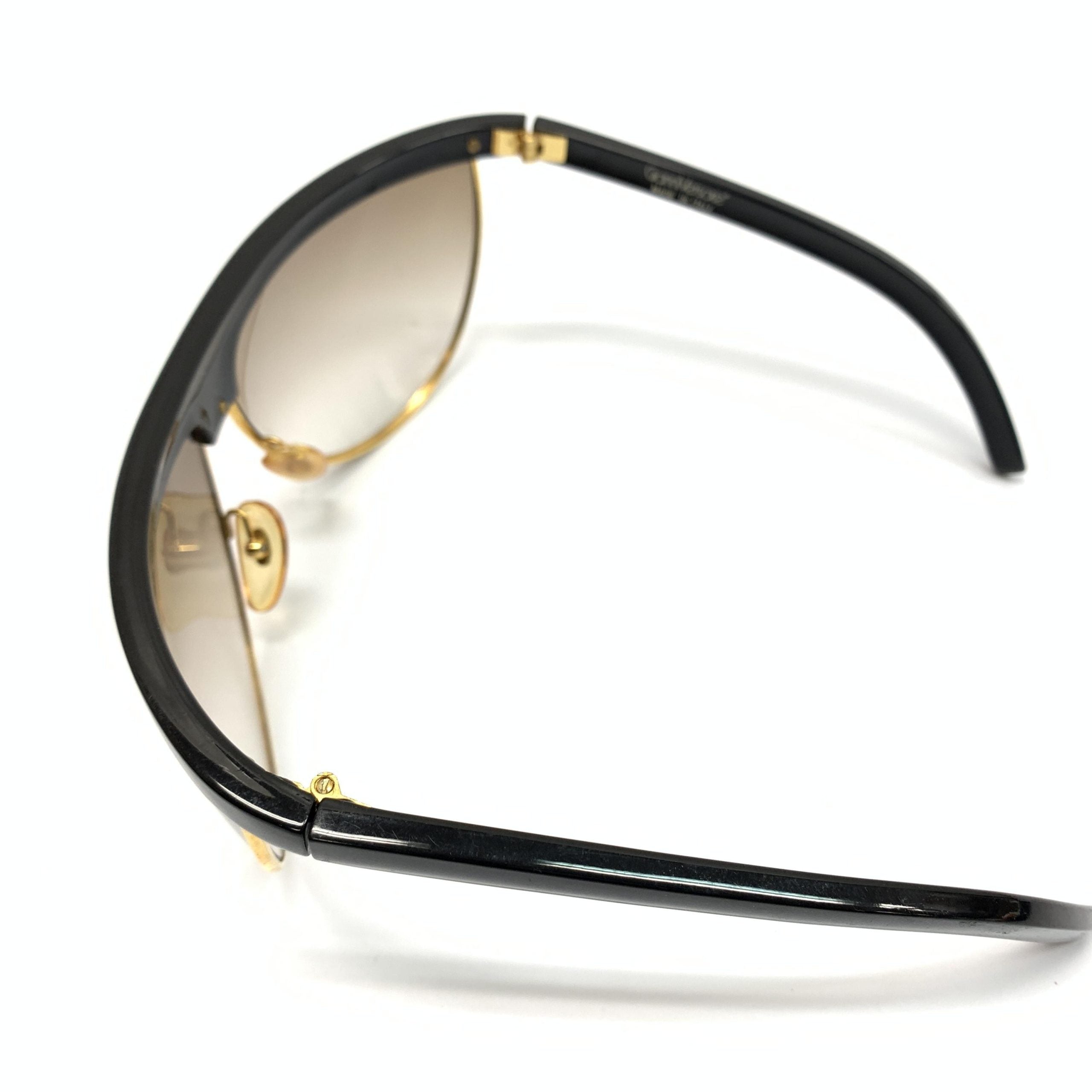 Lunettes de soleil sport polarisées Versace Versache avec monture élégante et verres protecteurs, pour un style sportif et sophistiqué.