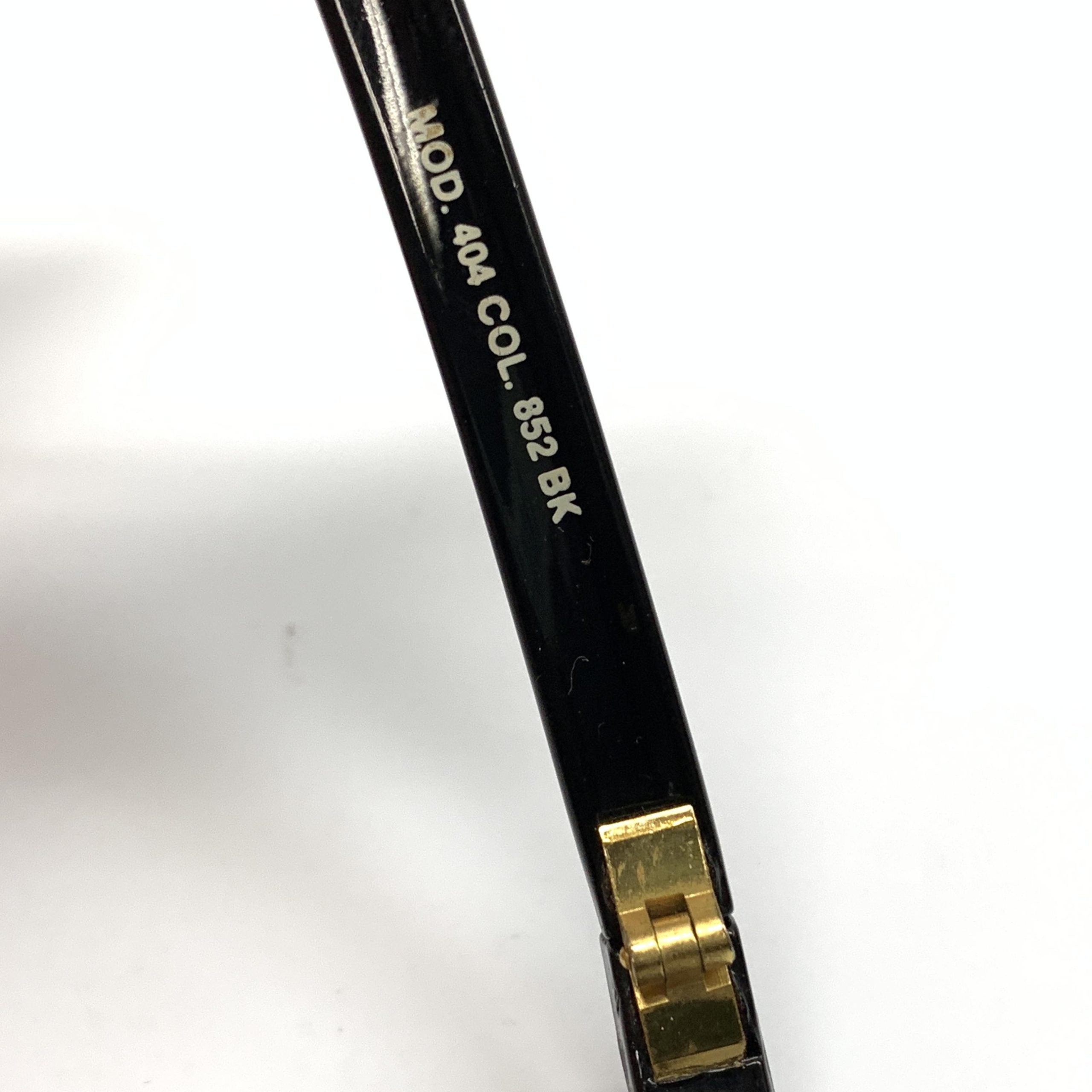 Lunettes de sport polarisées Versace Versache, design élégant avec monture en acétate et verres protecteurs, pour un style sportif.