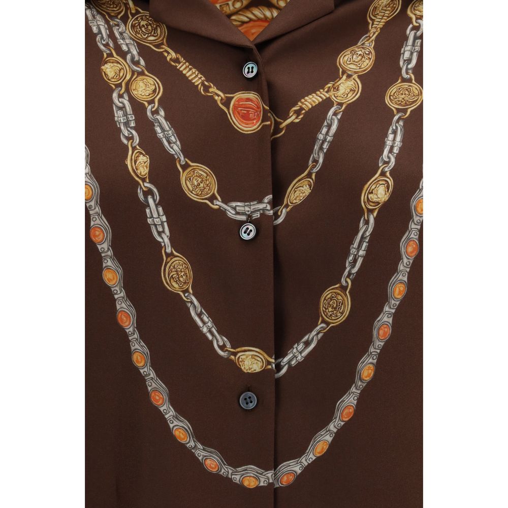Chemise Versace en tissu marron avec motif élégant, manches longues et col classique.