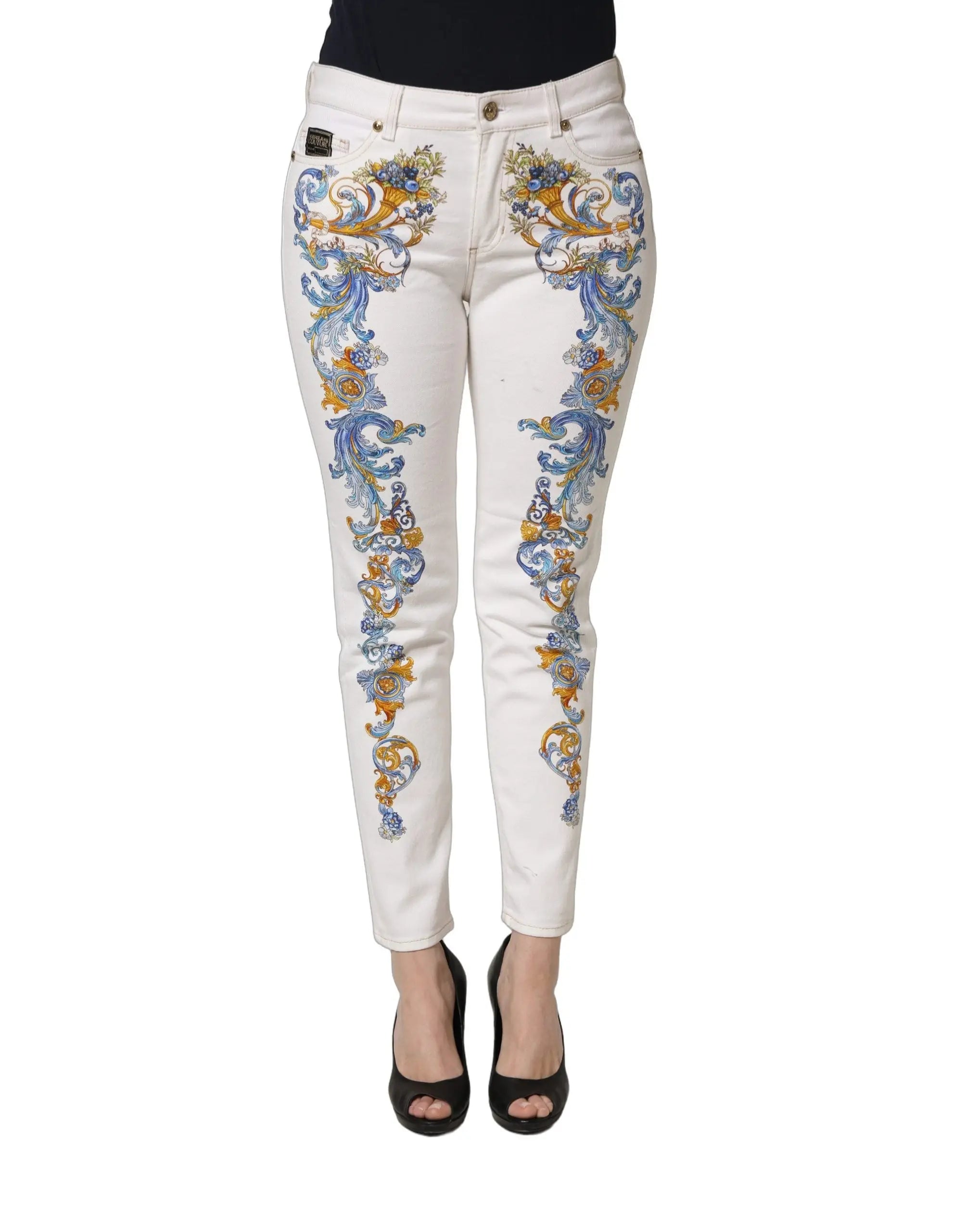 Jeans skinny en denim blanc versace jeans couture avec motifs floraux bleus et dorés ornant les jambes extérieures