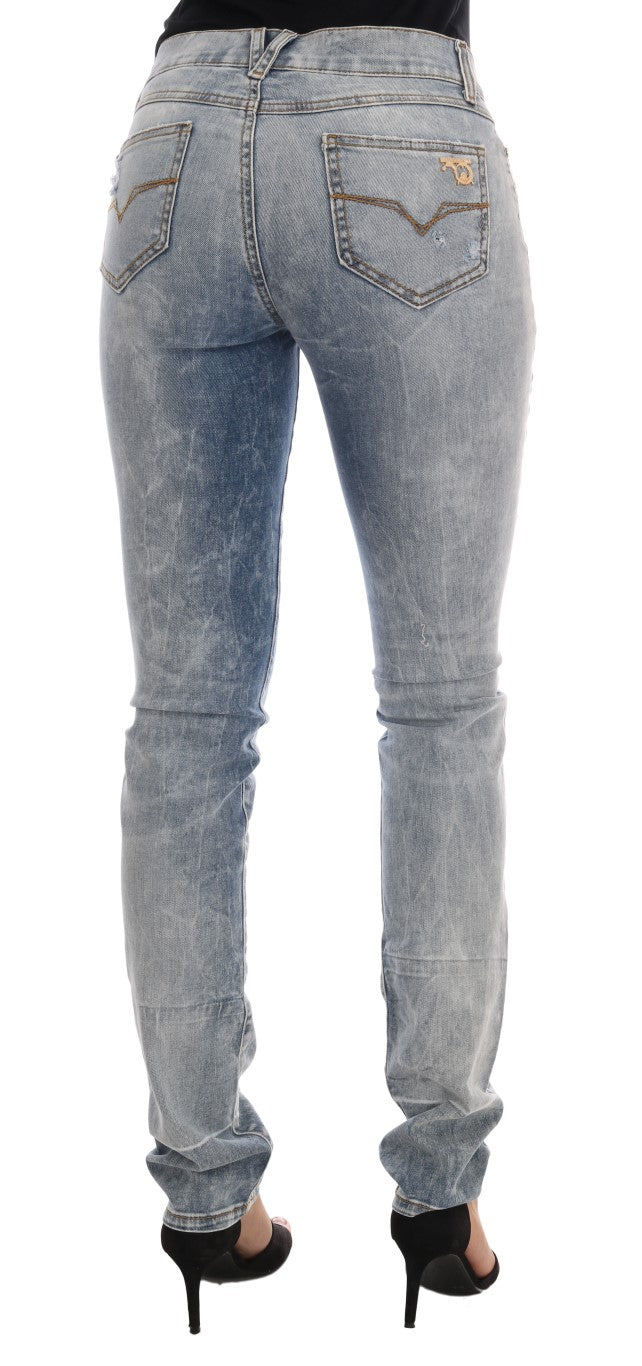 Jean slim stretch bleu avec déchirures et lavage vintage de la marque Versace Jeans, style décontracté et tendance.