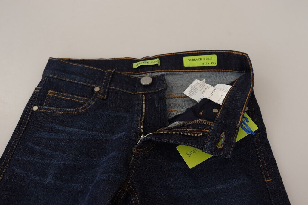 Jean skinny en denim bleu foncé de Versace Jeans, coupe basse, en coton, style slim pour homme.