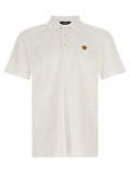 Versace polo blanc en coton avec col classique, patte de boutonnage trois boutons et logo tête de méduse brodé