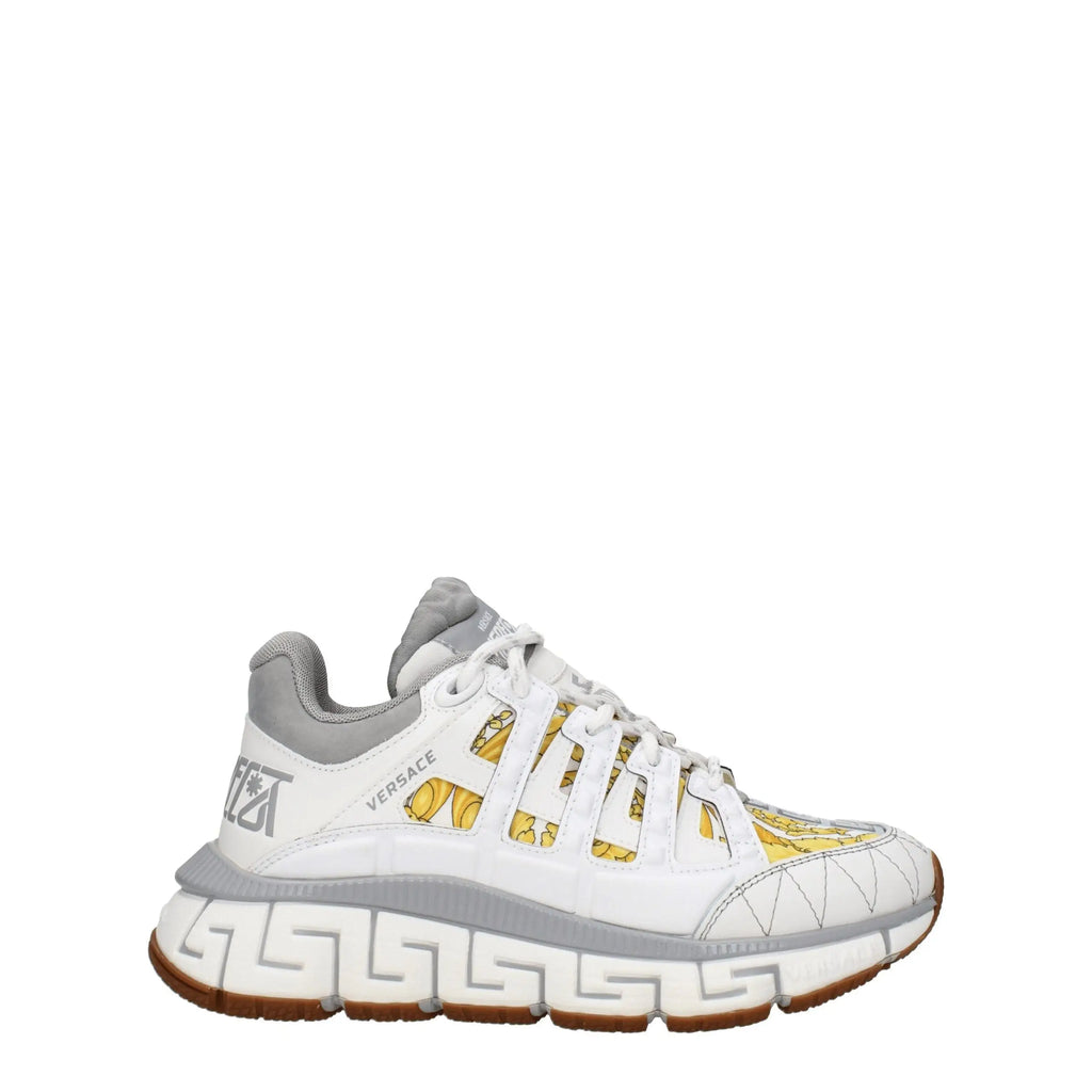 Versace white fabric athletic sneakers with gold medusa head pattern and gray greek key detailing on the sole
