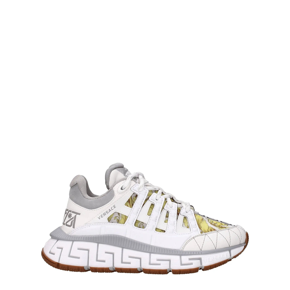 Versace white leather athletic sneakers with gray accents, Greek key pattern sole, and translucent panels showing greenish-yellow print